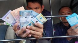Cara menukar uang baru di Bank Mandiri untuk Lebaran 2025, konfirmasi, bawa dokumen, dan ikuti prosedur di cabang terdekat. (Foto Ilustrasi/Istimewa)