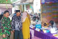 Tangkapan Layar Kepala Desa Benda, di dampingi Babinsa Benda dalam kesempatan itu menyampaikan apresiasi terhadap semangat gotong royong warga dan kerja keras para kader posyandu. (Istimewa) 